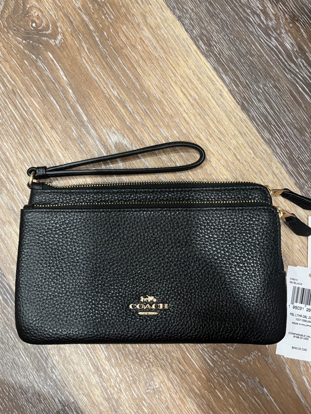 Coach Black Pebbled Leather Double-Zip Wristlet with Gold Logo, never used.
